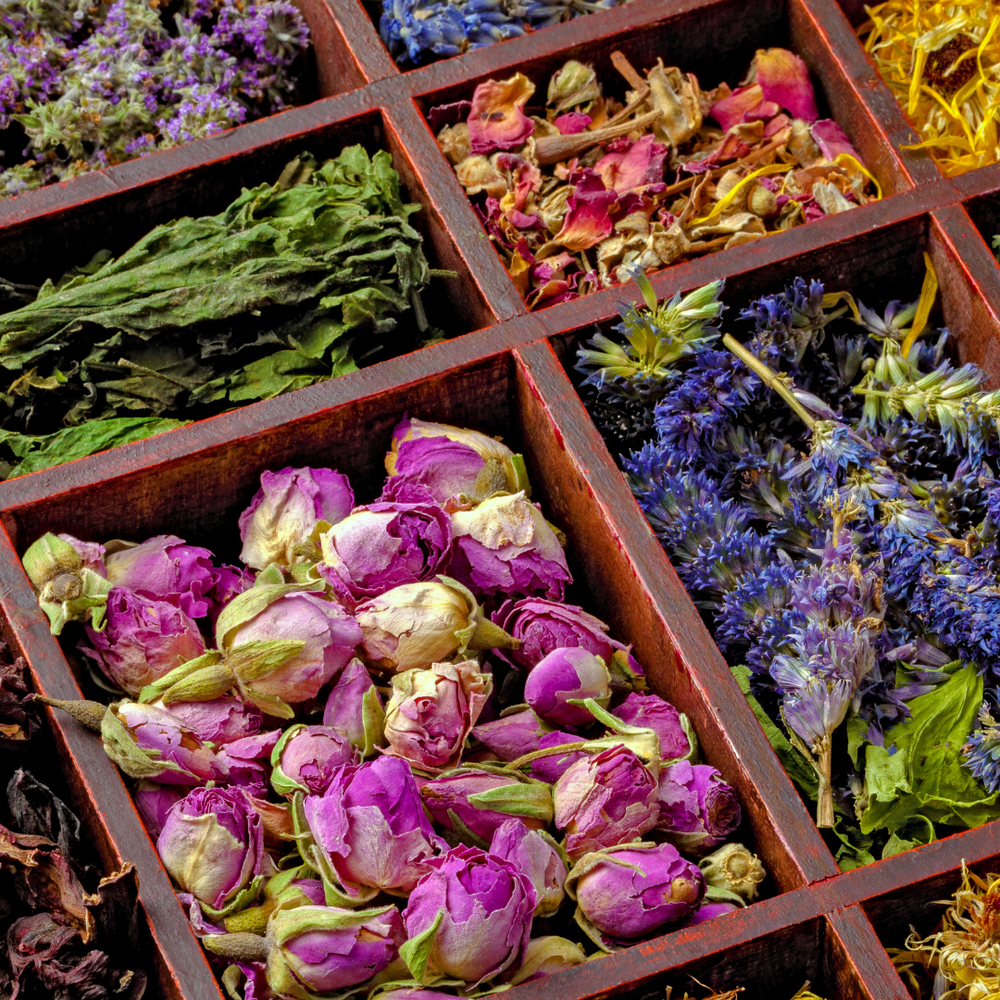 Ayurvedic herbs arranged in wooden compartments