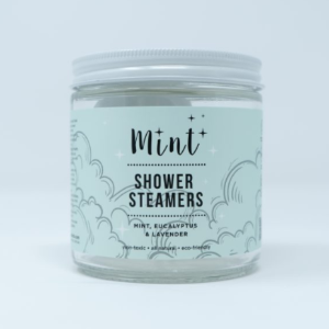 A clear jar with a mint green label that says Mint, shower steamers.