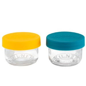 Kilner brand glass jars with 125mL capacity and easy-on silicone lids. Ideal for story and transporting small snacks, such as fruit, veggies, nuts, and seeds for convenience or on-the-go.