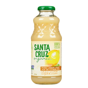 A bottle of organic lemon juice on a white background