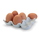 White porcelain egg crate that holds up to 6 eggs at a time.