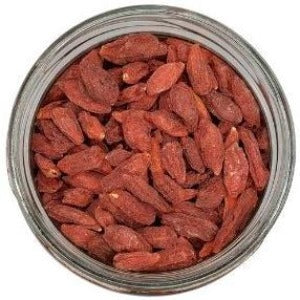 Goji Berries in a jar with a white background