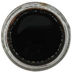 White background with a glass jar filled with Organic Balsamic Vinegar.