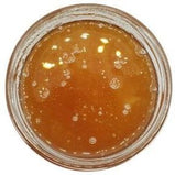 Honey Unpasteurized in a jar with a white background