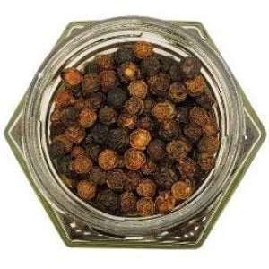 White background with a glass jar filled with Whole Black Peppercorn. 