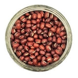 White background with a glass jar filled with dry organic Adzuki Beans. 