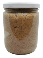 White background with a clear, glass jar filled with organic Roasted Almond Butter sealed with a white lid.