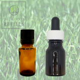 Two Essential oil bottles are in front of a picture of Citronella grass.