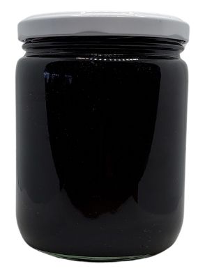 White background with a clear, glass jar filled with Organic Blackstrap Molasses sealed with a white lid.