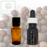 Two Essential oil bottles are in front of a picture of allspice berries.
