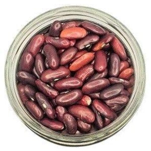 A jar showcases Organic Dark Red Kidney Beans, displaying deep red, kidney-shaped legumes. The beans, with their rich hue, promise nutritional richness and purity. The dark red beans, with their distinct kidney shape, exude an inviting and wholesome appearance, encouraging a closer exploration of their rich, natural qualities and organic goodness.