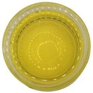 White background with a glass jar filled with Apricot Kernel Oil.