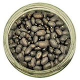 White background with a glass jar filled with Organic Black Beans.