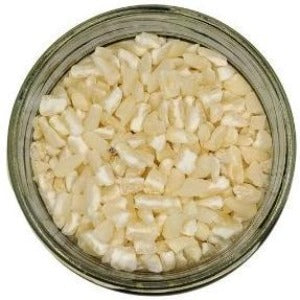 Hominy Grits in a jar with a white background
