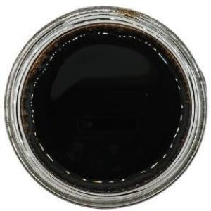 White background with a glass jar filled with Blueberry Balsamic Vinegar. 