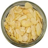 White background with a glass jar filled with Sliced Almonds.