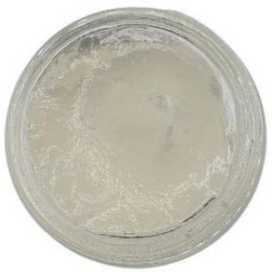 White background with a glass jar filled with Aloe Vera Gel.